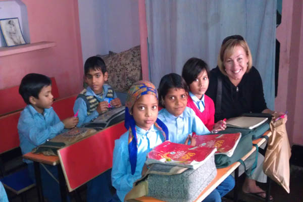 PAVE team members with community children